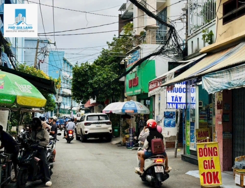 BÁN NHÀ MẶT TIỀN HẺM XE HƠI HUỲNH TẤN PHÁT - QUẬN 7 . 